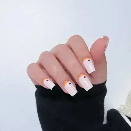 Captivating Valentine's Day Nail Designs, Nude French Nails with Black Heart.Edgy-Yet-Elegant Nude French Tip Nails to Try The Every girls.